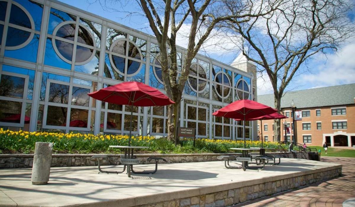 Student Center patio tables on Alumni Way